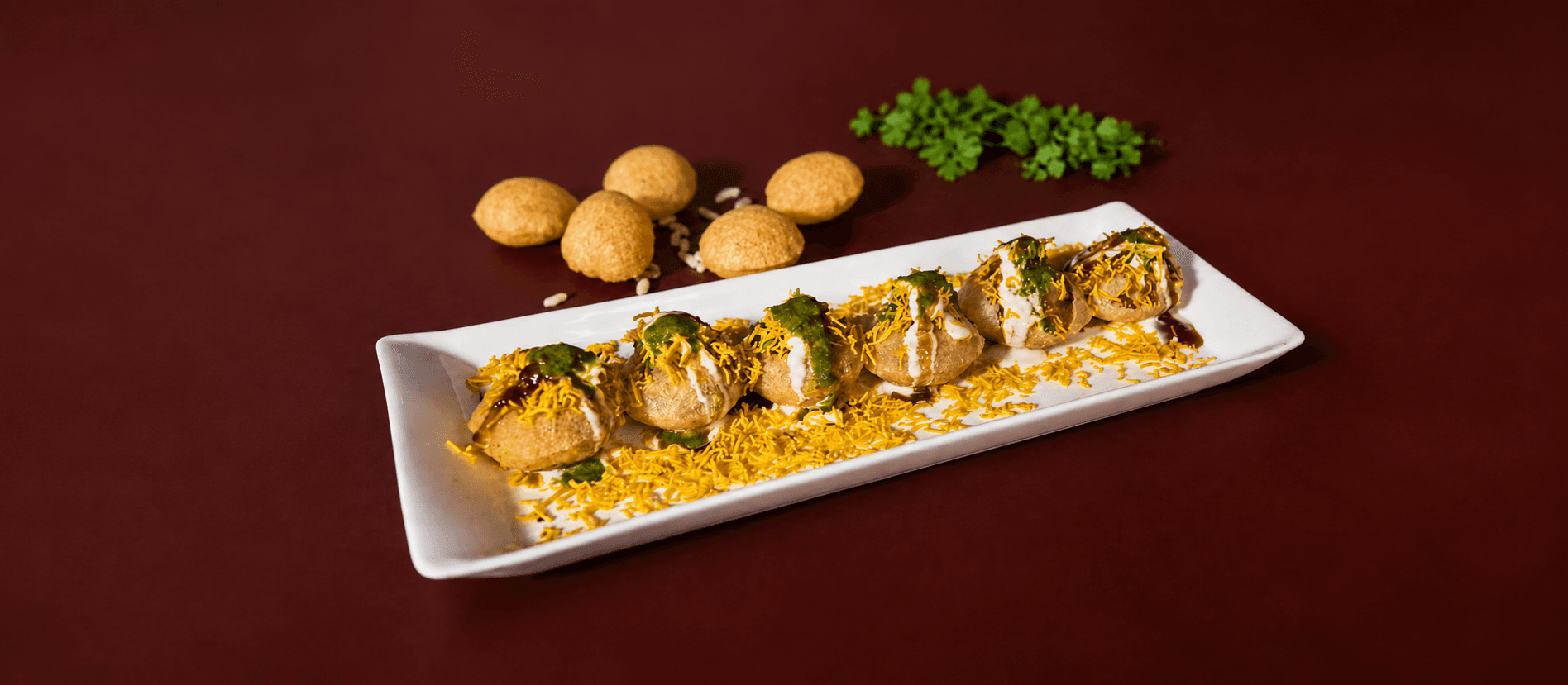 Indian street-food style chaat plated for a catering event