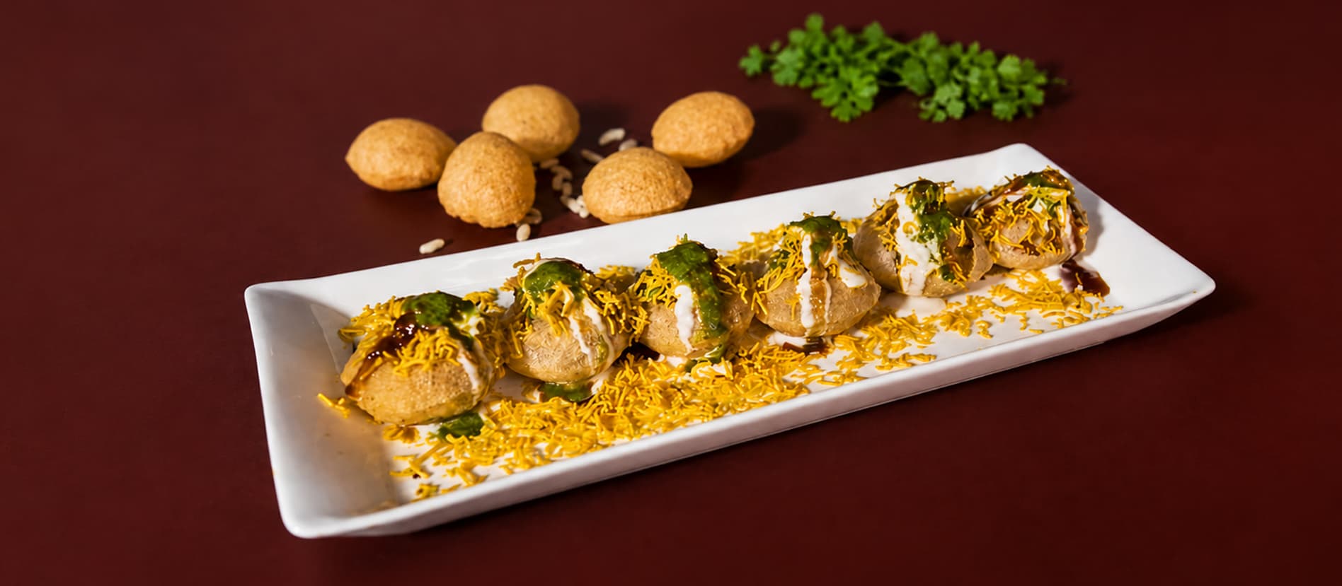 Chaat and street food plated for an event