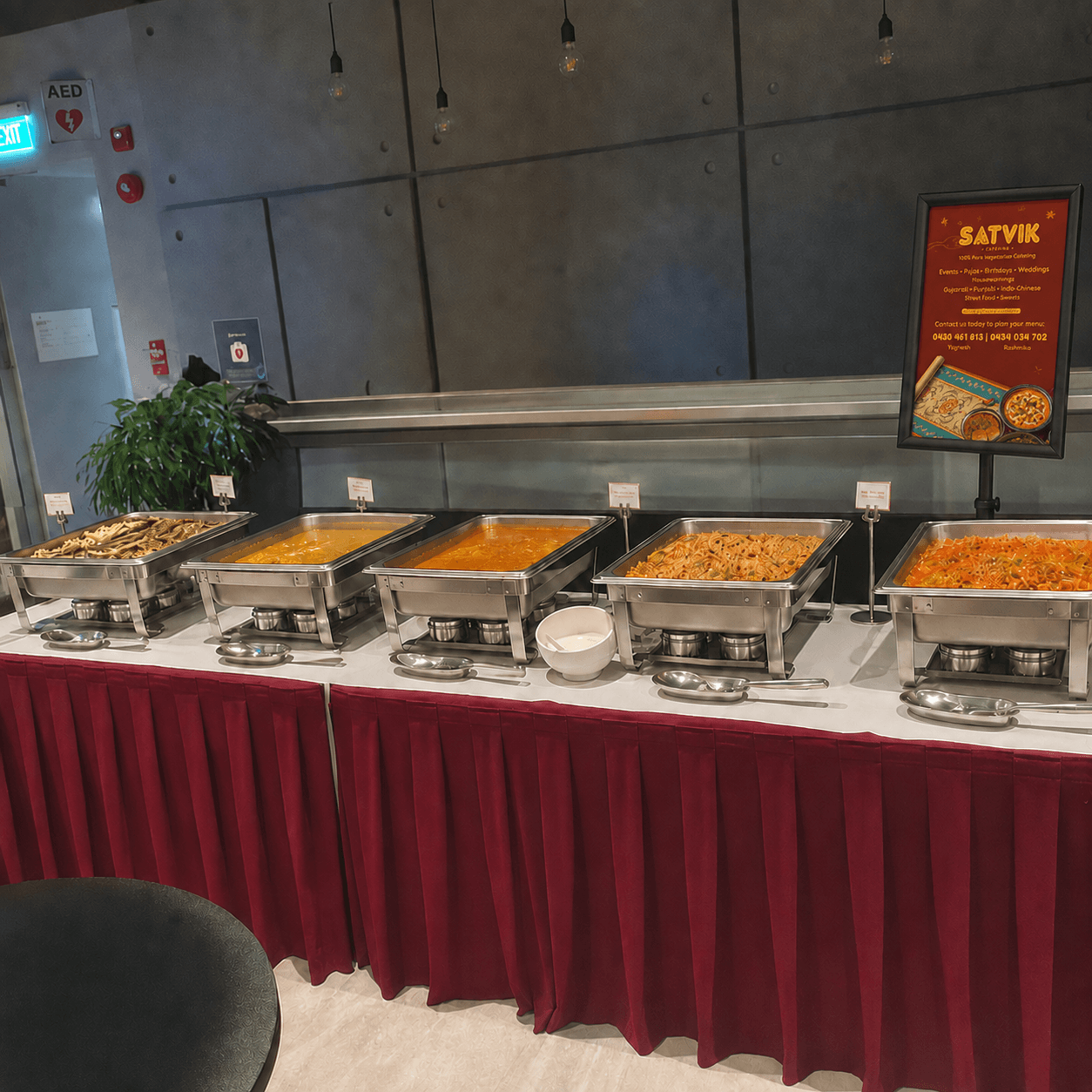 A buffet setup styled for a corporate conference or celebration